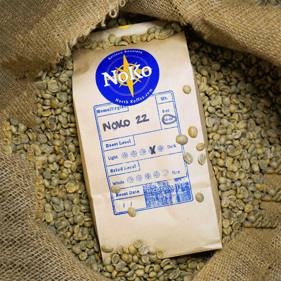 Espresso NoKo22 coffee atop a jute coffee bag with green coffee beans