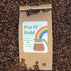 Pot O' Gold coffee surrounded by beans