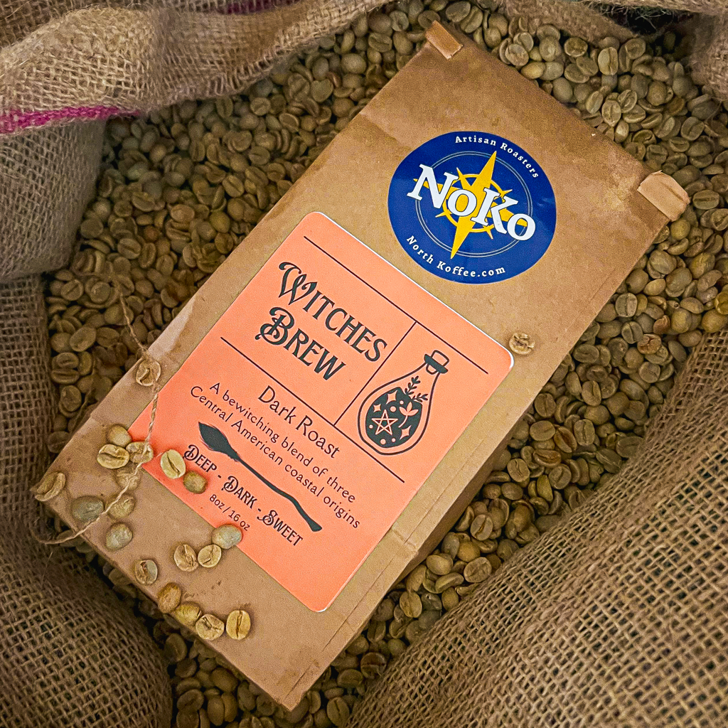 witches brew coffee surrounded by coffee beans