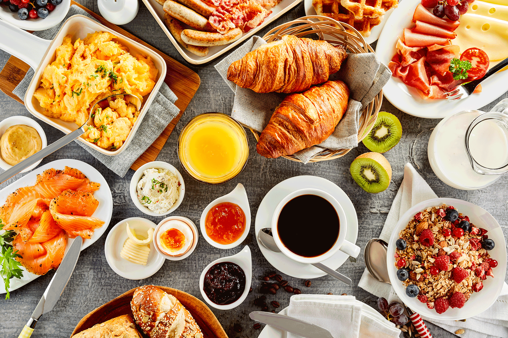 delicious looking catering table covered with food and coffee