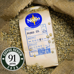 noko 22 espresso blend coffee on a bag  of green coffee and displaying tn award