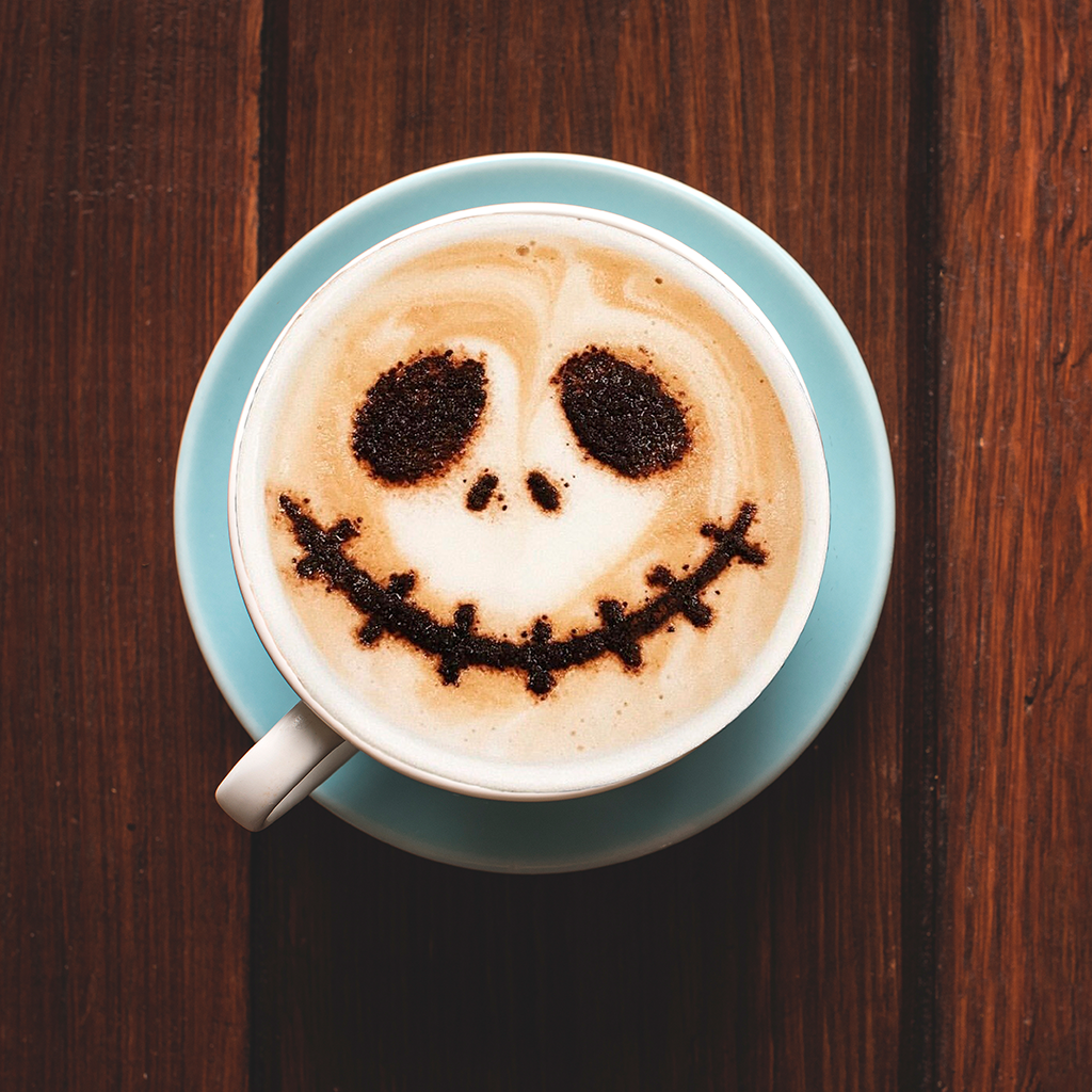 cup of coffee with spooky face design