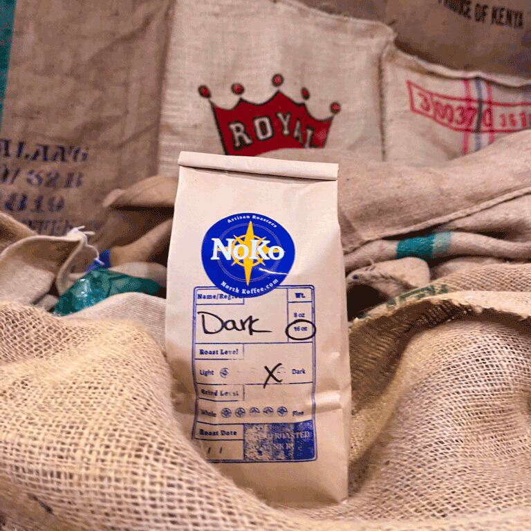 North Koffee roasted Dark Roast coffee atop jute coffee bag in the North Koffee Roasterie and Cafe