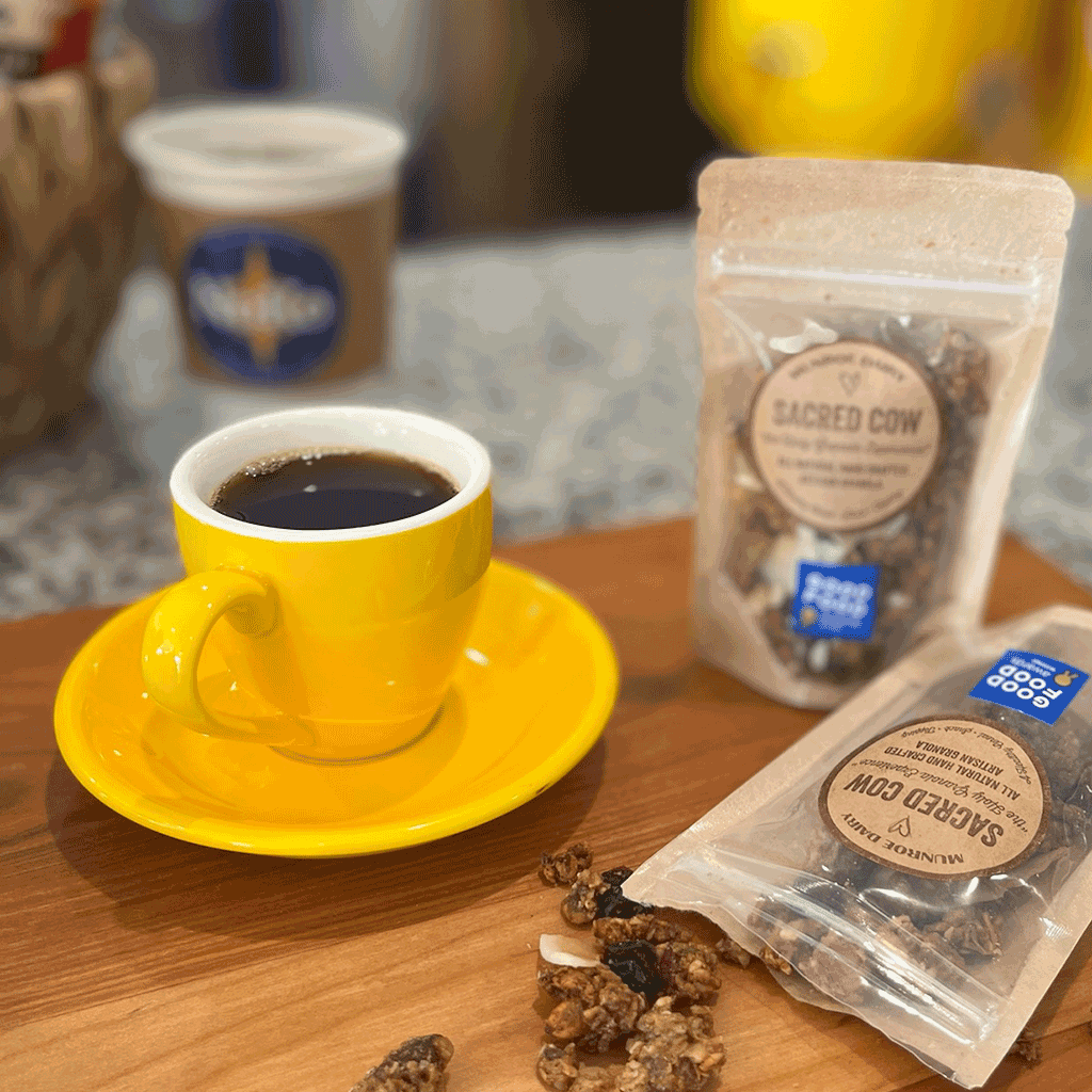 Cup of Pink Moon Blend coffee with snacks